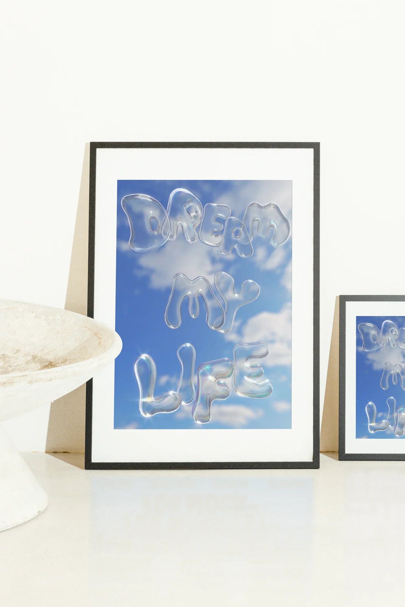 Des bulles irisées flottent dans un ciel lumineux, chaque lettre murmurant un rêve impossible.. blue, digital, minimalist, typographic, white